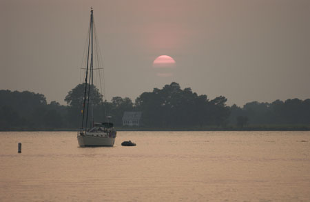 strand sailboat sunset